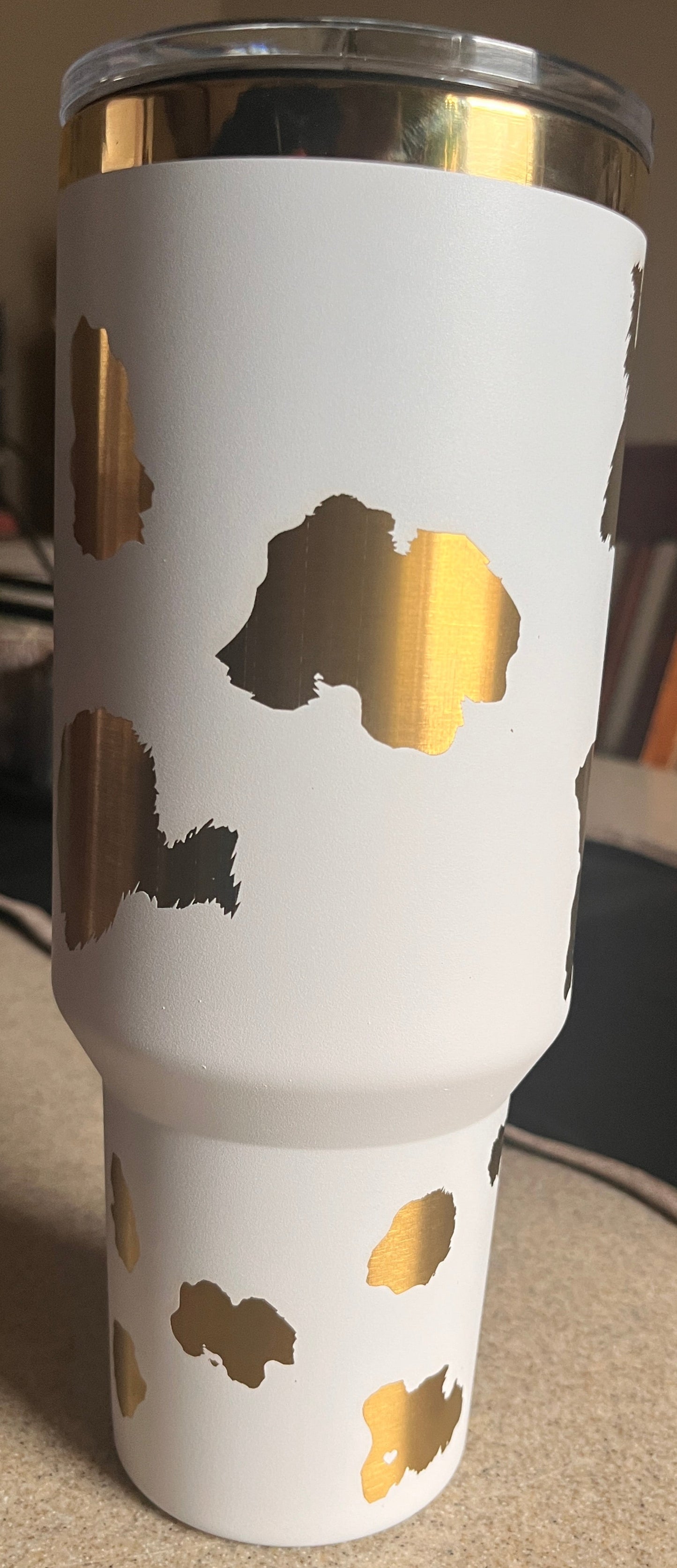 White tumbler with gold designs
