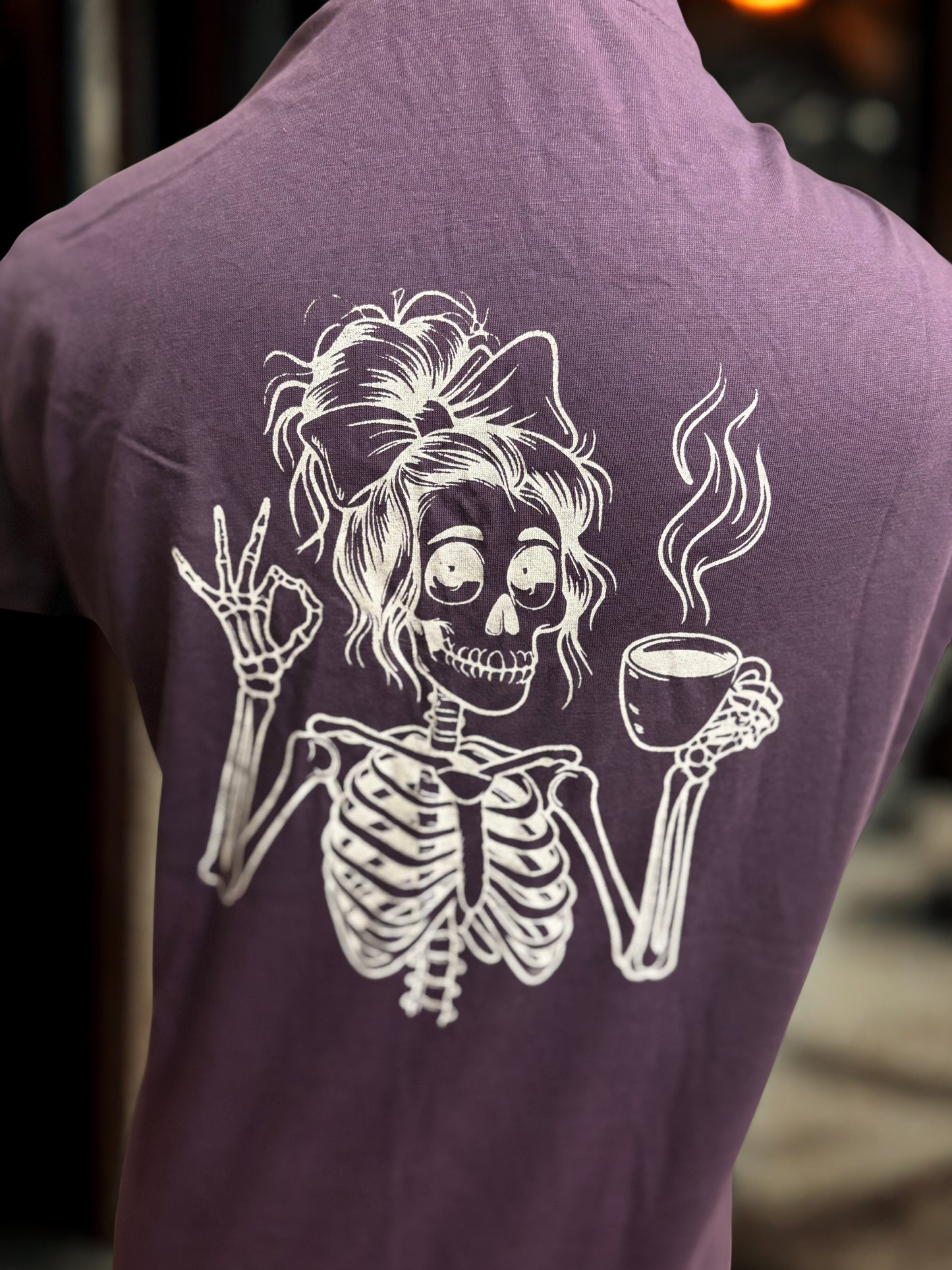 Brew-tifully Bold: Purple Tee with Sassy Skeleton & Coffee Design