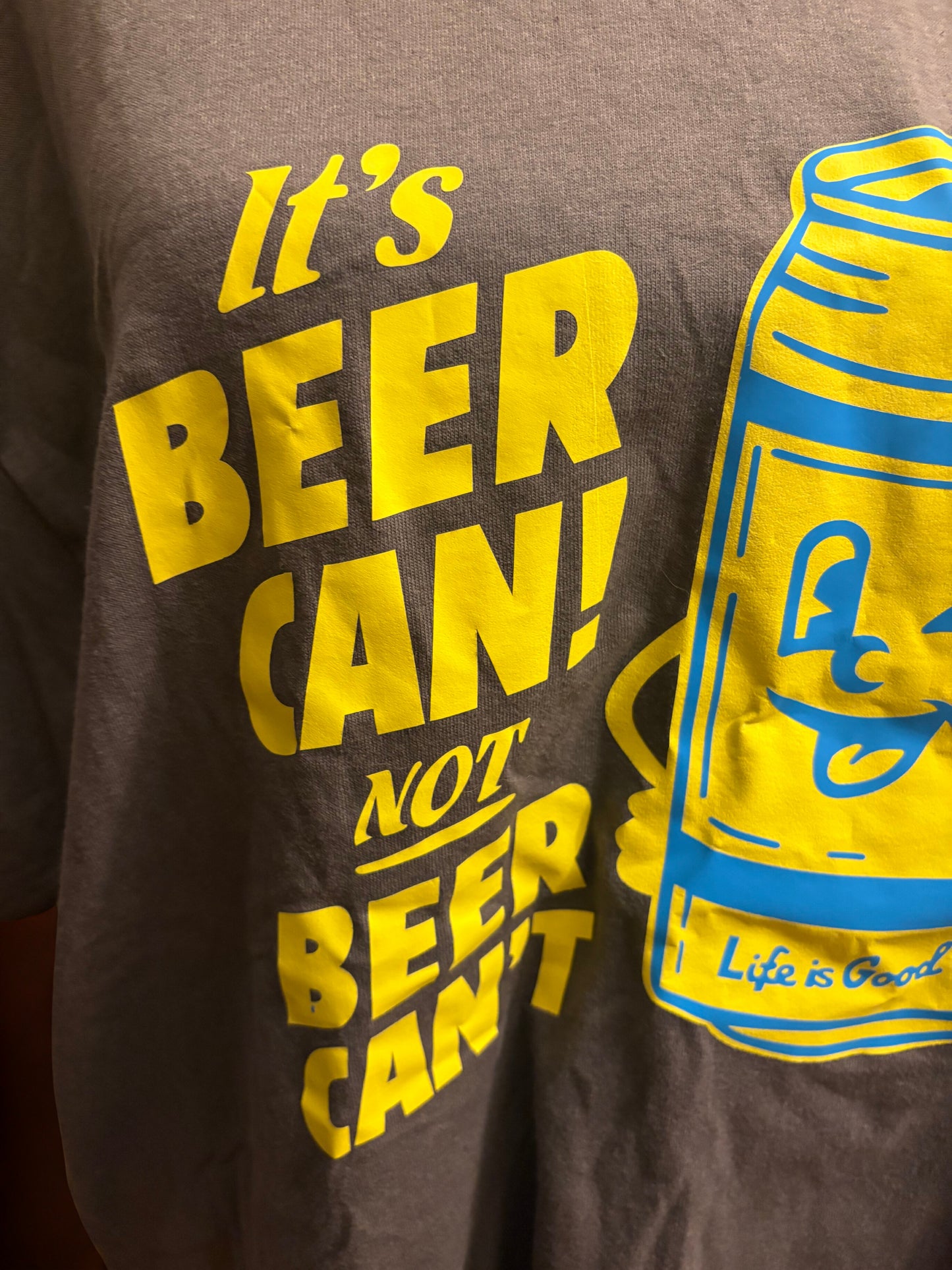 Cheers to Optimism: Brown Tee with Winking Beer Can Fun
