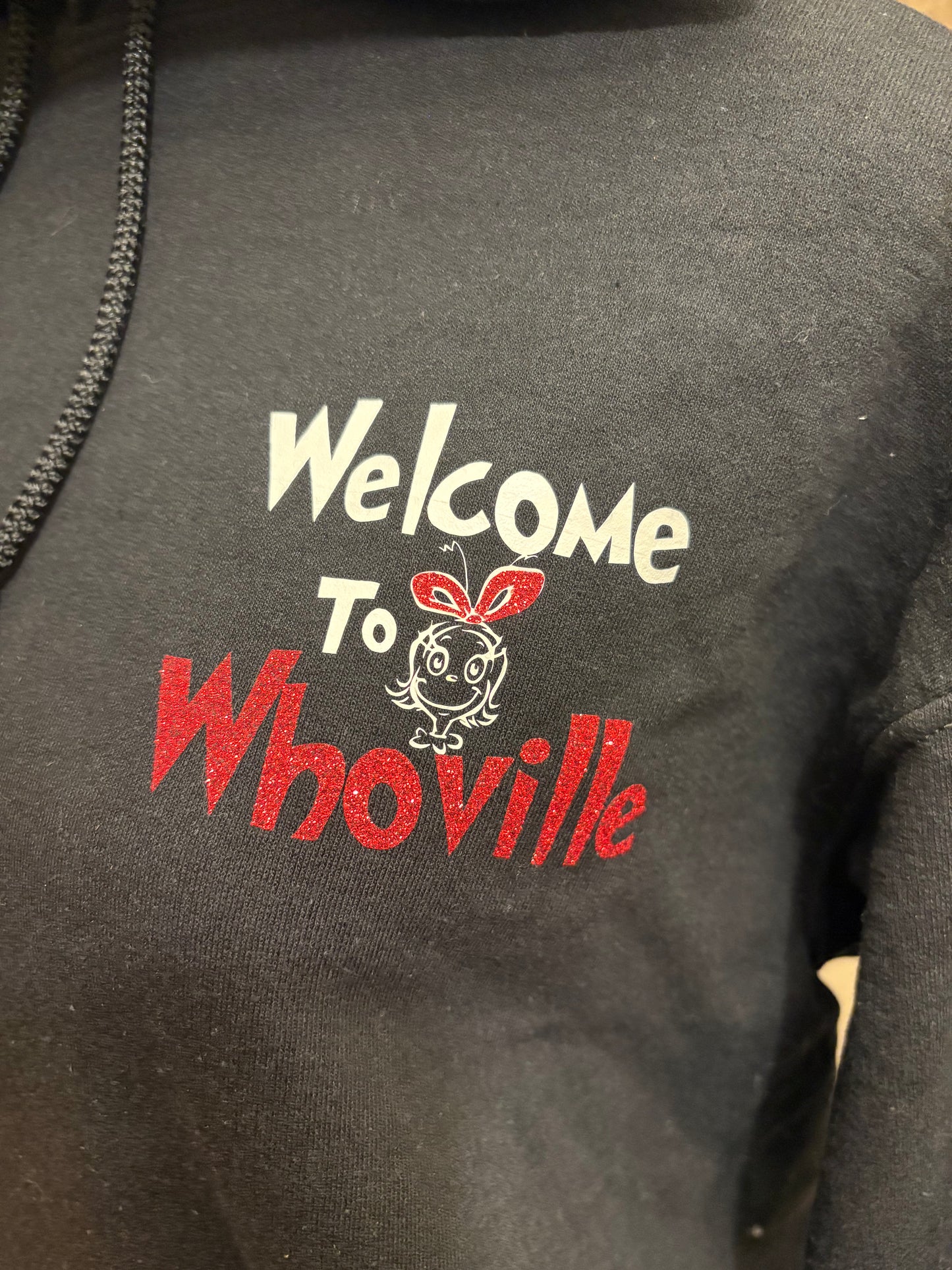 Grinchy Greetings: Whoville Welcome Black Hoodie