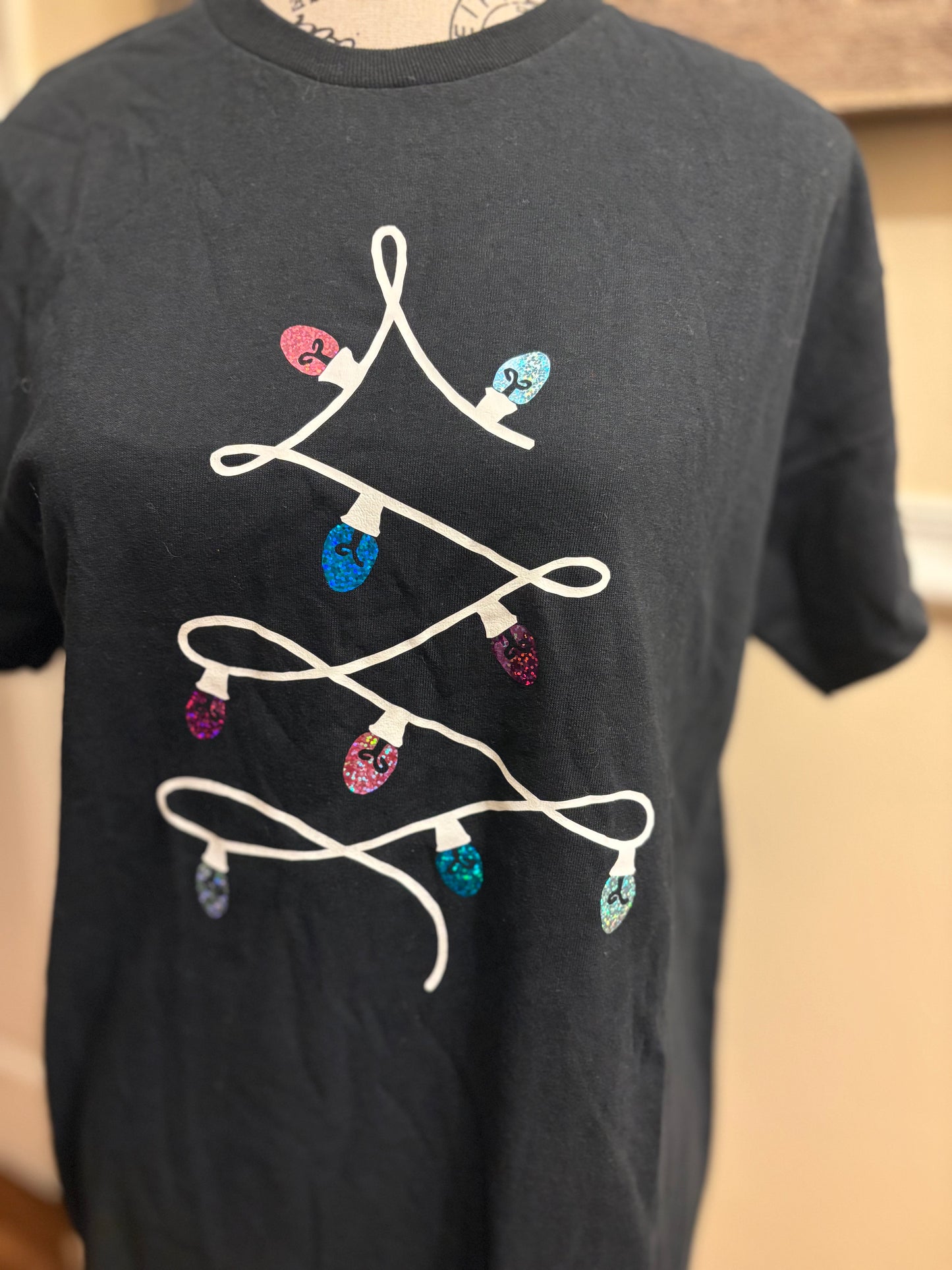 Festive Glow: Minimalist Christmas Tree Light Tee